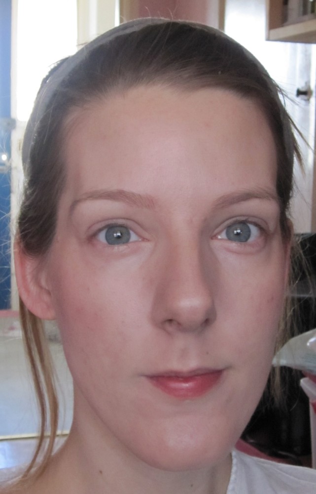 Liz Earle Perfect Finish Powder Foundation with blusher and highlighter applied.